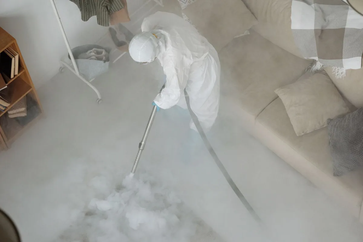 Biohazard cleanup technician in protective equipment, Bayou Country Club, LA